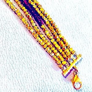 NWOT Bracelet multi strand gold and ruby bead bracelet.
